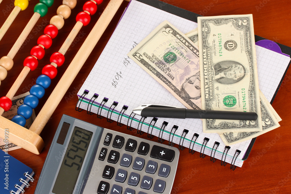 Bright wooden abacus and calculator. Conceptual photo of old Bright wooden abacus and calculator. Conceptual photo of old