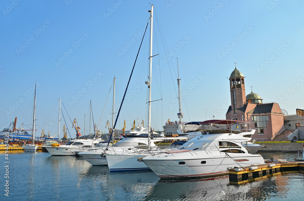 White motor yacht over harbor pier, Odessa, Ukraine