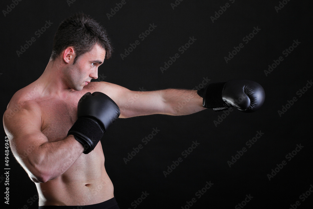 Portrait sportsman boxer in studio dark background