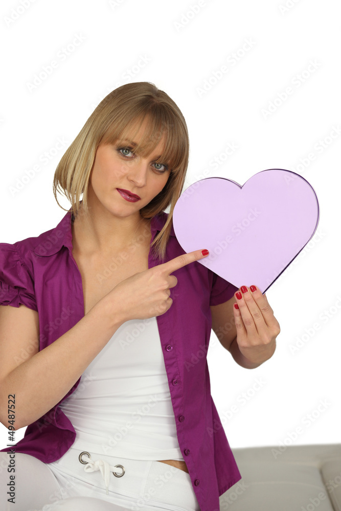 Woman holding a heart-shaped box Woman holding a heart-shaped box