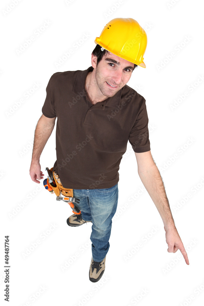 Construction worker pointing to the floor Construction worker pointing to the floor