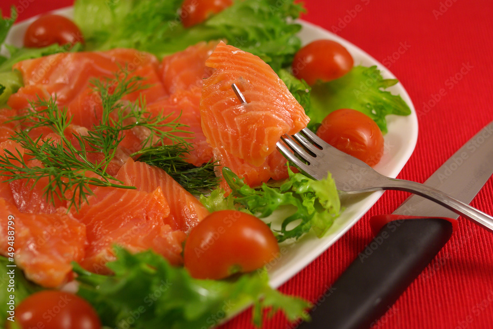 Trout with vegetables on a platter Trout with vegetables on a platter