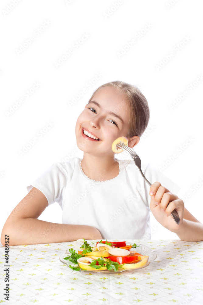 Fun girl eating summer vitamin salad Fun girl eating summer vitamin salad