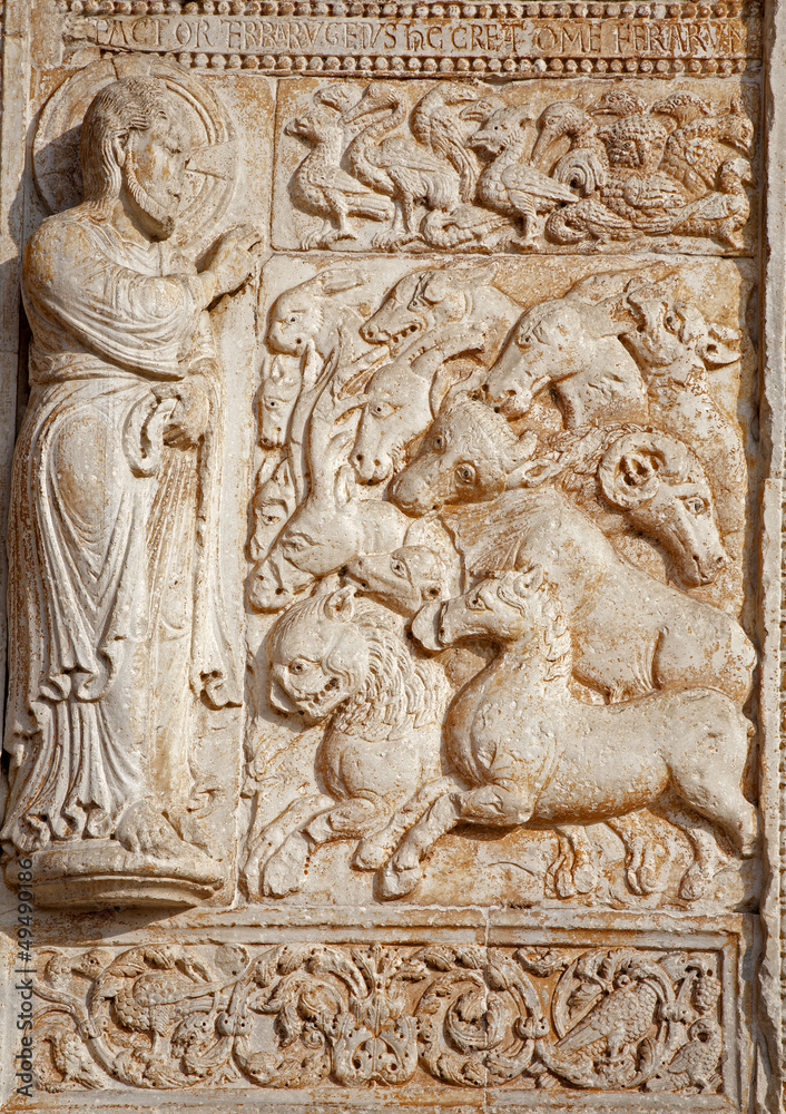 Verona - Relief of creation from facade of  Basilica San Zeno.