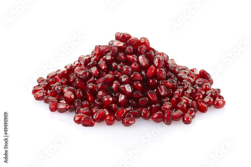 Pomegranate seeds heap on white with clipping path