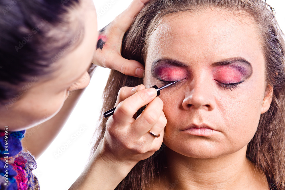 make up artist applying make up on actress make up artist applying make up on actress