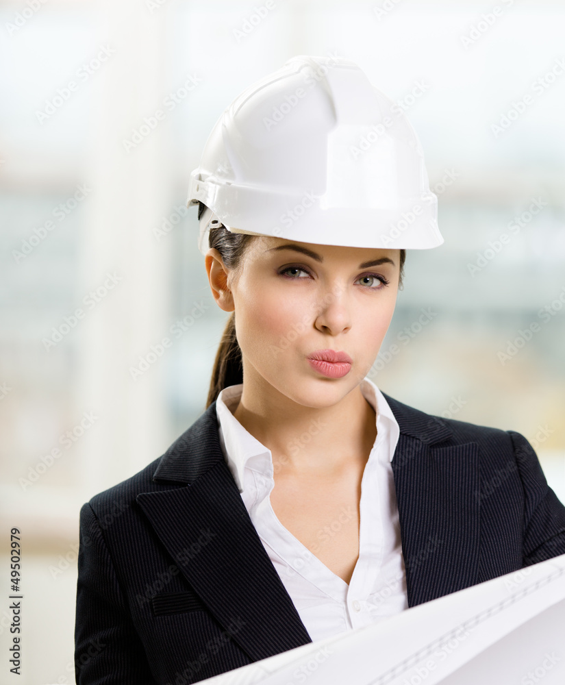 Female engineer in white hard hat hands blueprint Female engineer in white hard hat hands blueprint