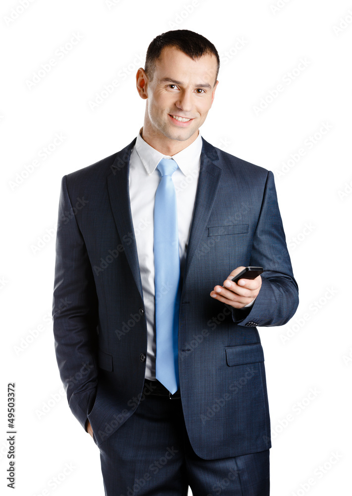 Businessman in suit and blue tie handing phone