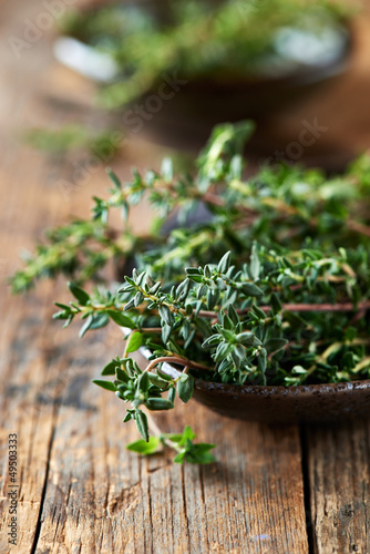 Bunch of fresh thyme in a ceramic dish