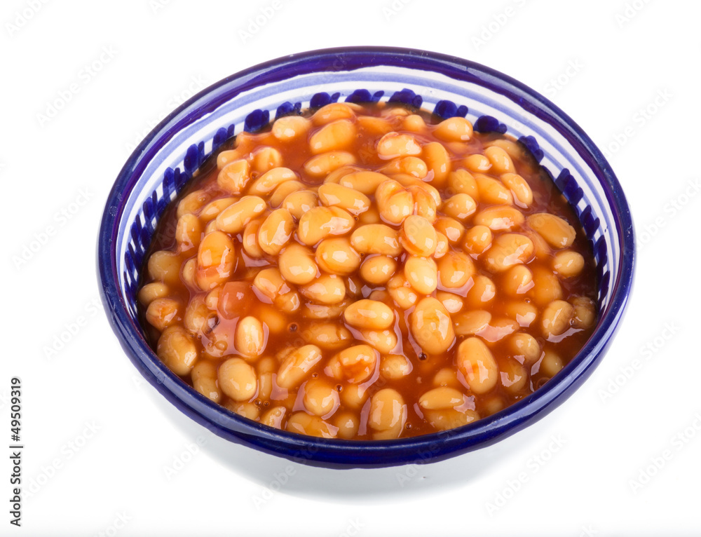 Marinated haricot beans in tomato sauce with shallots on a plate