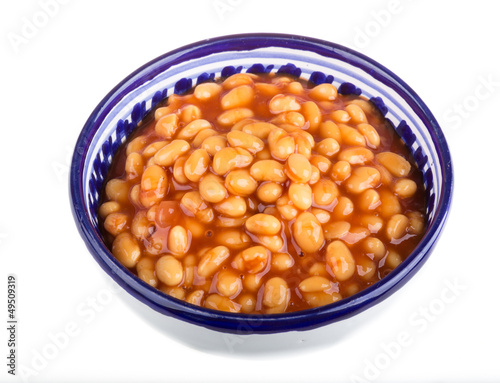 Marinated haricot beans in tomato sauce with shallots on a plate