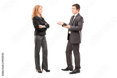 Full length portrait of a professional male and female having a