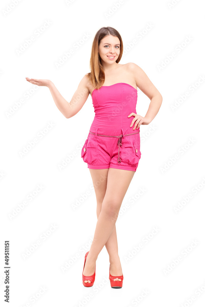 Full length portrait of a smiling woman gesturing with hand Full length portrait of a smiling woman gesturing with hand