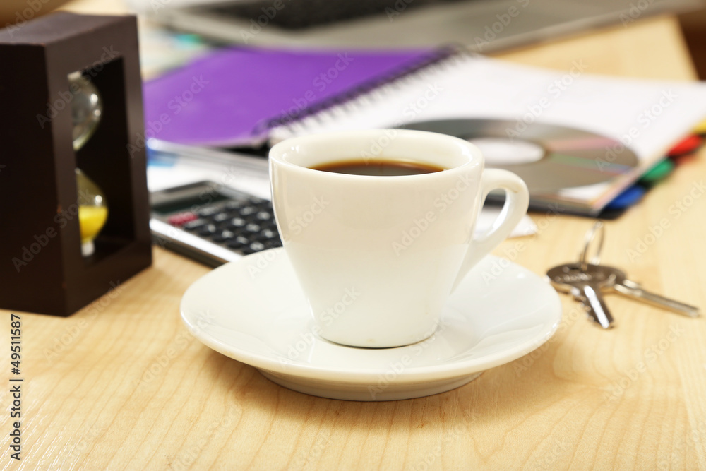 Cup of coffee on office desktop close-up Cup of coffee on office desktop close-up