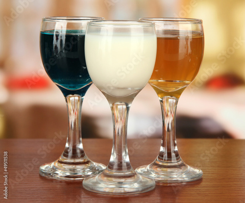 Tasty color liquors, on bright background