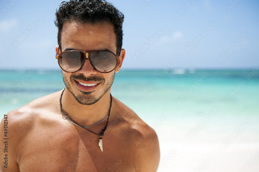 Portrait of an attractive young man on a tropical beach Portrait of an attractive young man on a tropical beach