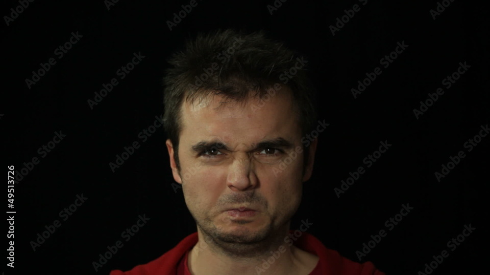 Angry furious man grimacing, studio isolated Angry furious man grimacing, studio isolated