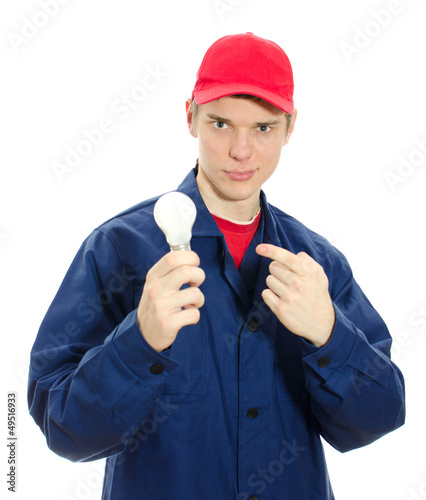 Young electrician in uniform with bulb. Isolated on white photo