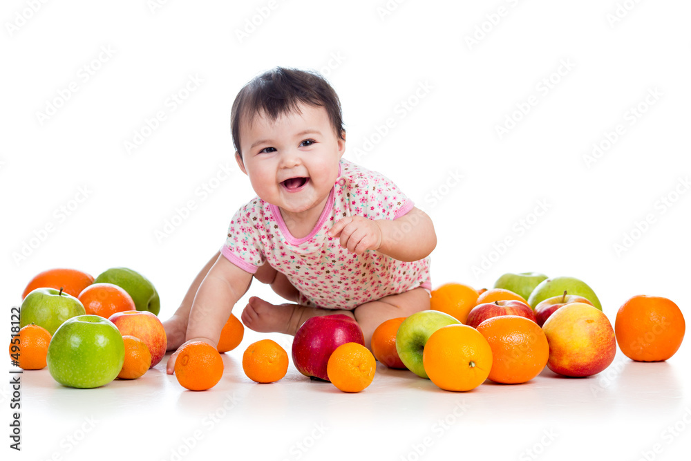 happy baby girl sitting among fresh fruits happy baby girl sitting among fresh fruits