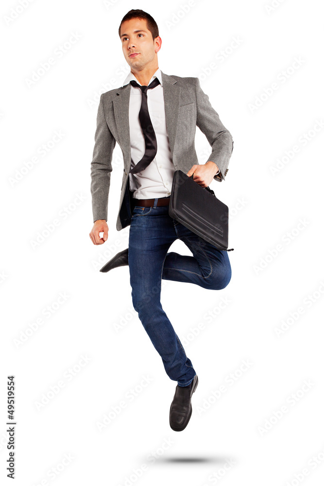 Young businessman jumping with briefcase Young businessman jumping with briefcase