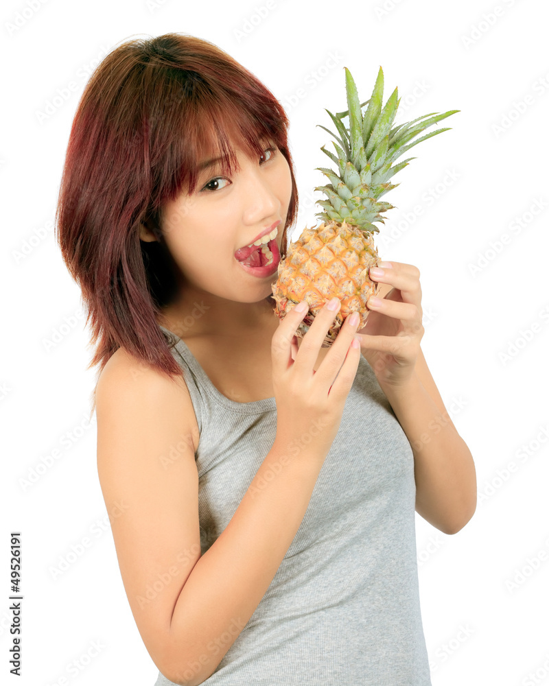 Isolated young asian woman with pineapple Isolated young asian woman with pineapple
