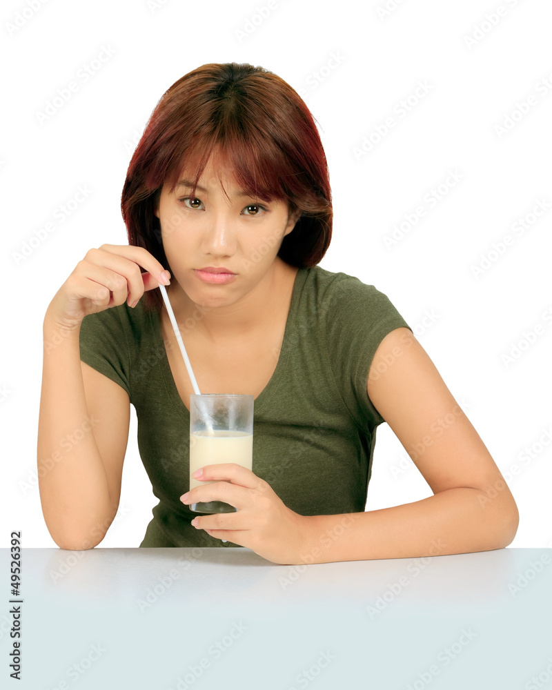 Isolated young asian woman with a glass of milk Isolated young asian woman with a glass of milk