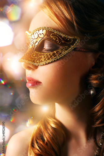 Beautiful girl in carnival mask