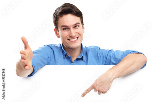 Man pointing at blank copy space