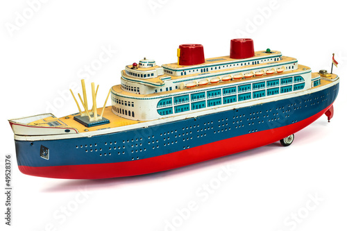 Antique toy cruise ship isolated on white photo