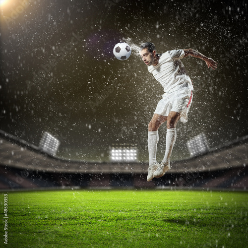 football player striking the ball