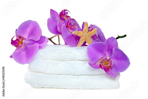 starfish and orchids on towels
