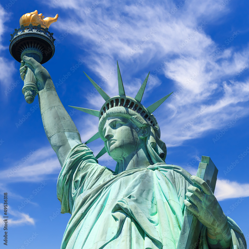 Fototapeta premium statue of liberty, new york, usa, blue sky with clouds