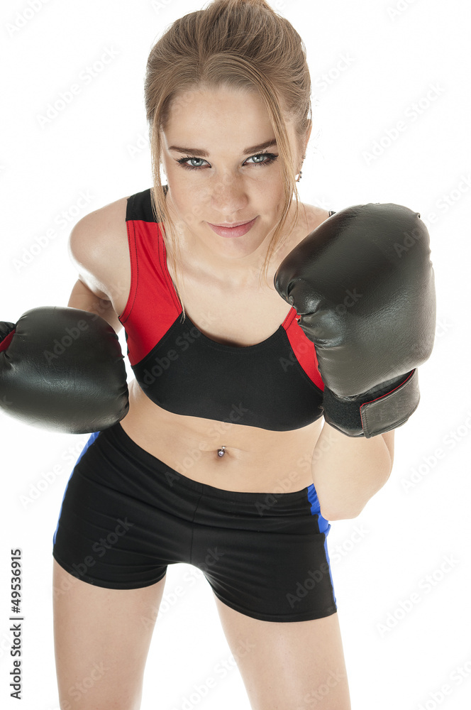 Beautiful  happy athletic  girl   wearing boxing gloves.