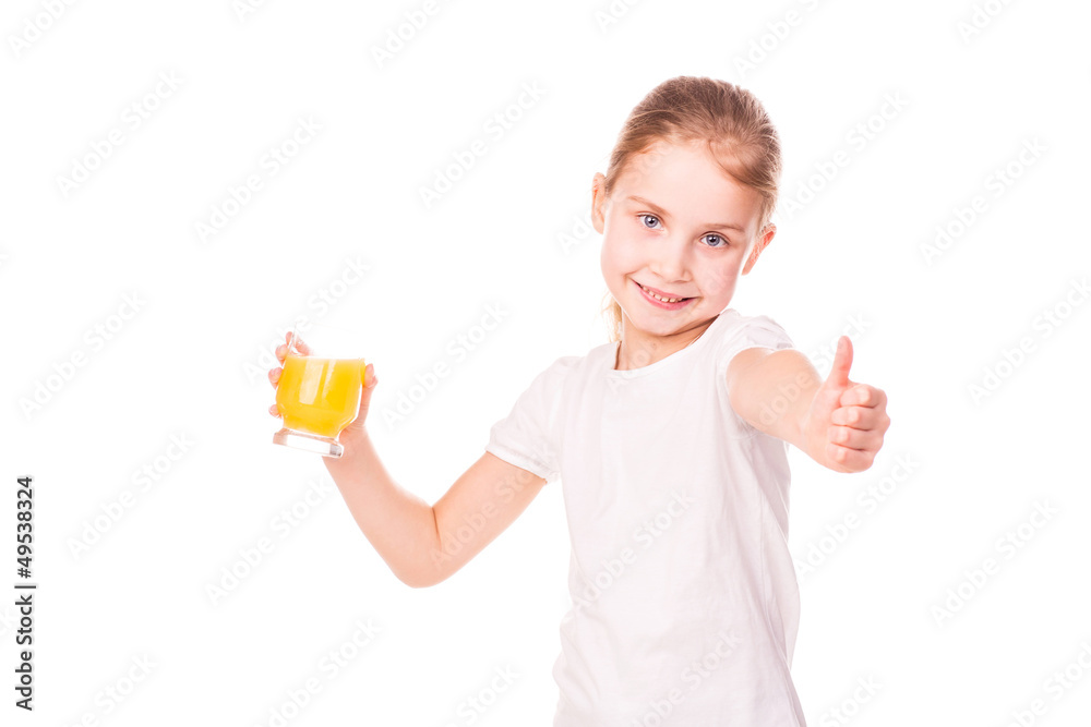 Cute little girl holding glass with juice smiling