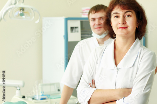 A medical doctors standing in dentist office