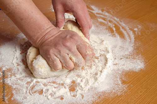 Wallpaper Mural Hands of the baker knead dough in a flour Torontodigital.ca