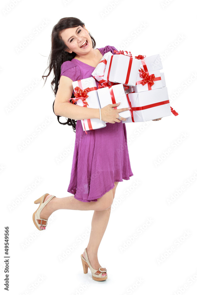 Happy woman carrying lots of presents Happy woman carrying lots of presents