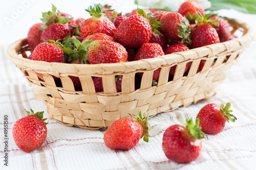 basket of ripe strawberries on napkin