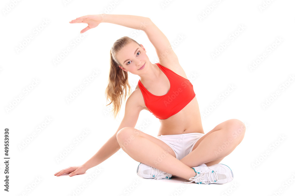 young sporty woman doing stretching exercise over white backgrou