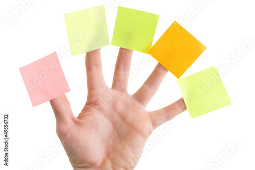 Hand with blank colorful post it notes