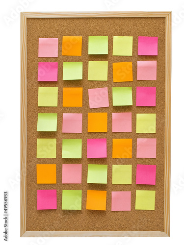 office cork board with colorful post it notes
