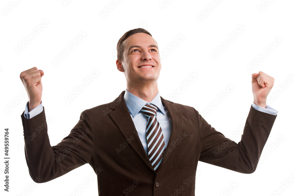 Business man throwing fists in air and smiling while celebrating Business man throwing fists in air and smiling while celebrating