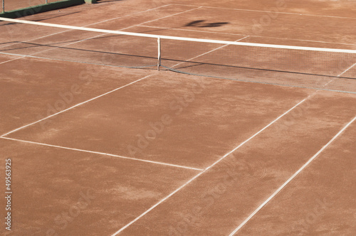 Clay surface tennis court. Dirt surface tennis court © cunaplus