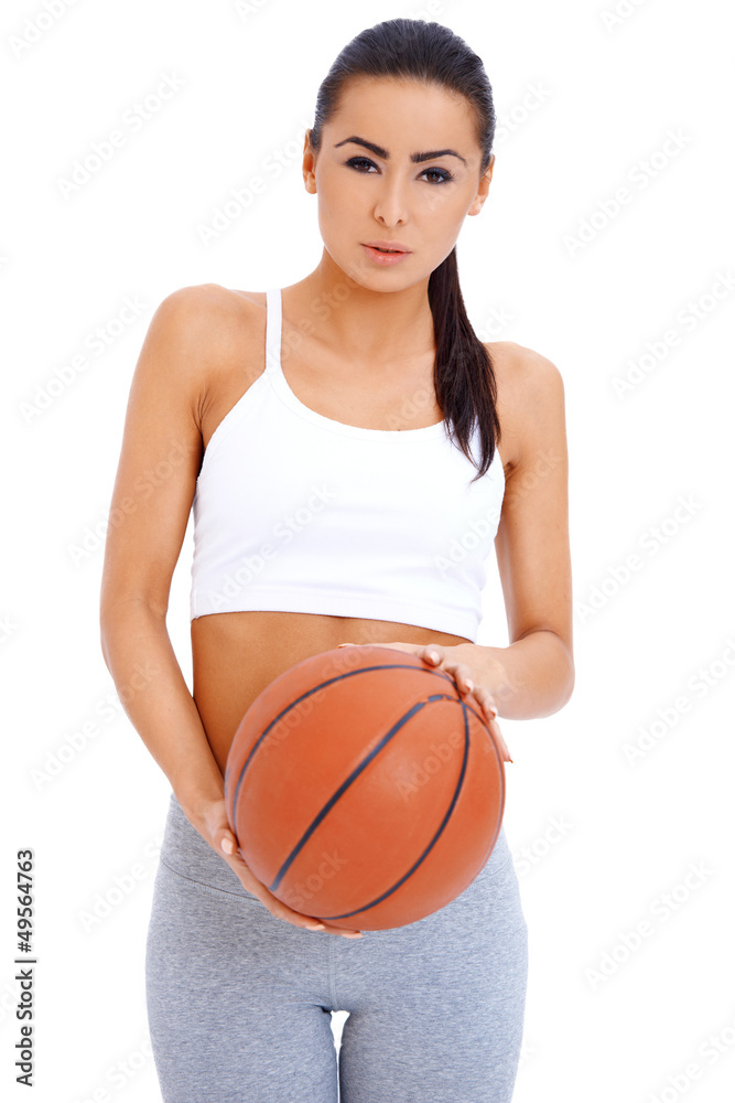 Woman standing and holding basketball Woman standing and holding basketball