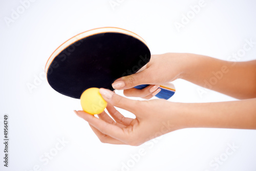Hands holding table tennis rocket and ball