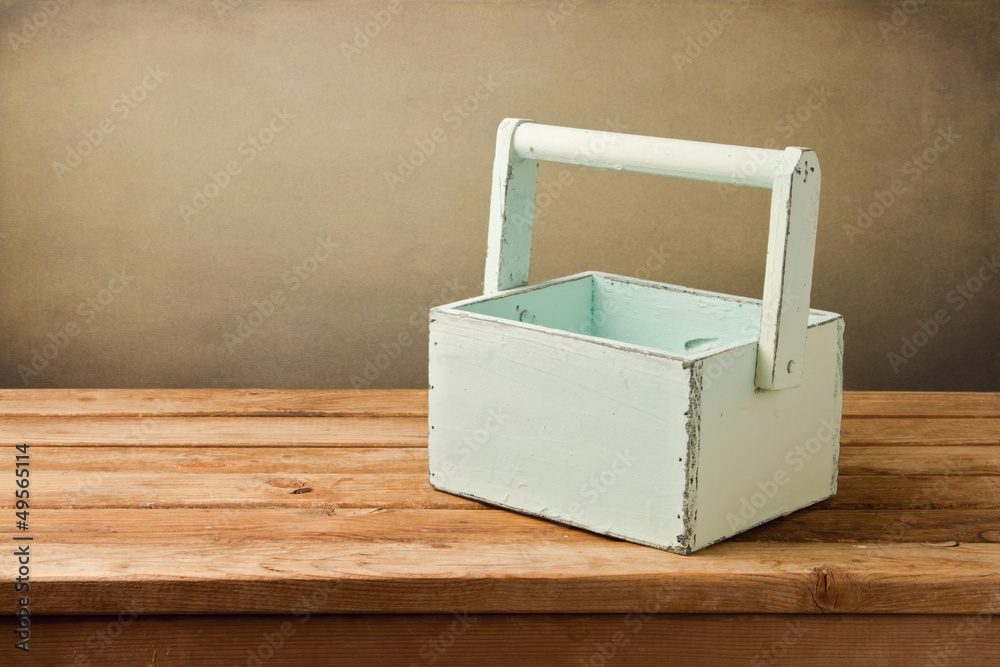 Empty wooden box on table over grunge background Empty wooden box on table over grunge background