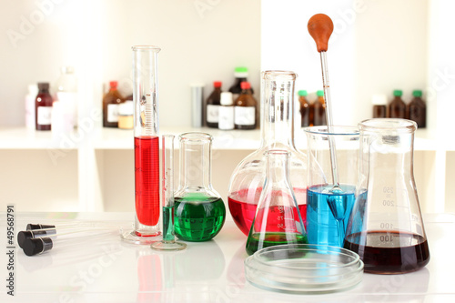 Different laboratory glassware with color liquid