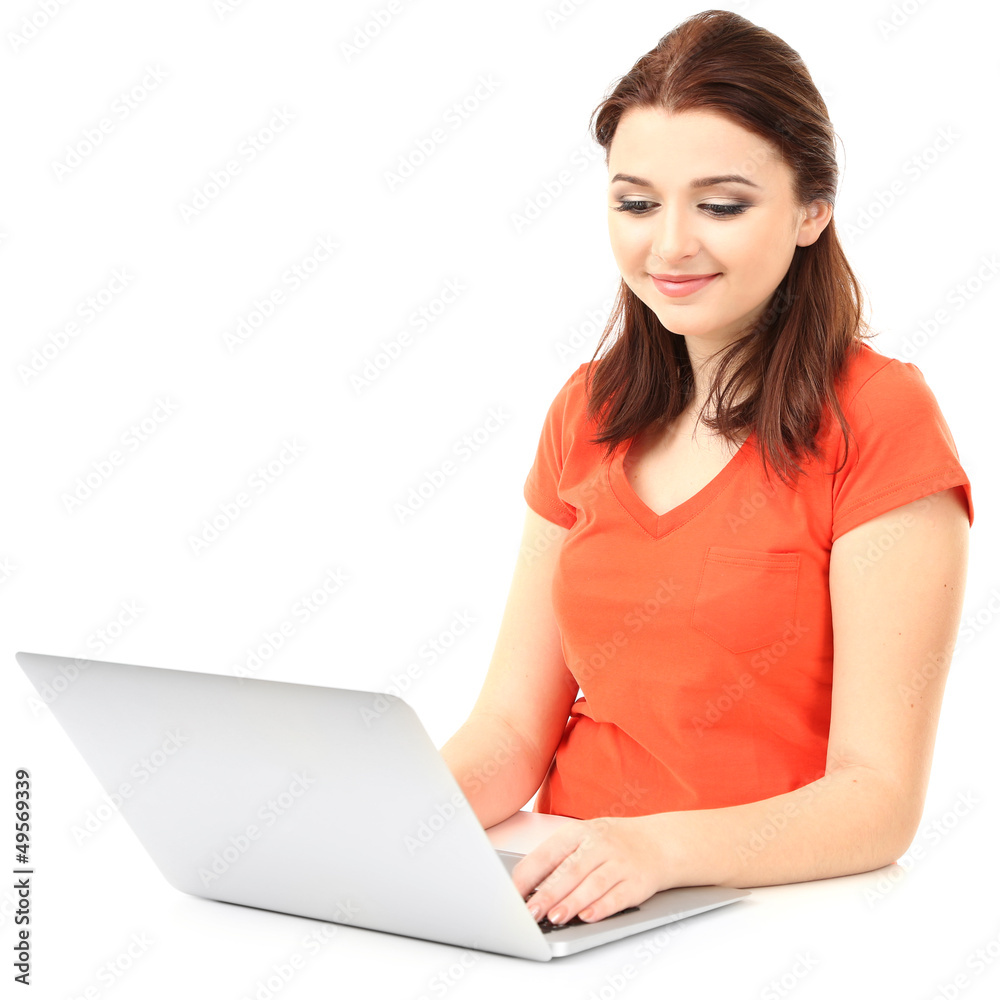 Naklejka premium Beautiful young woman with laptop isolated on white