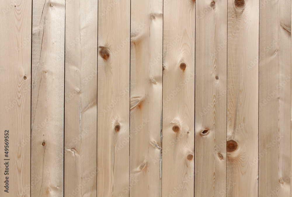 Detail in blonde knotted wood fencing Detail in blonde knotted wood fencing