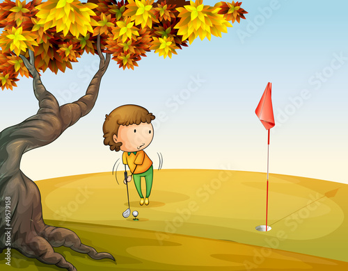 A woman playing golf at the park